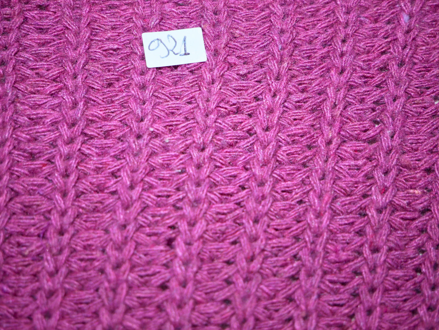 Purple sweater with crossed knot on the front