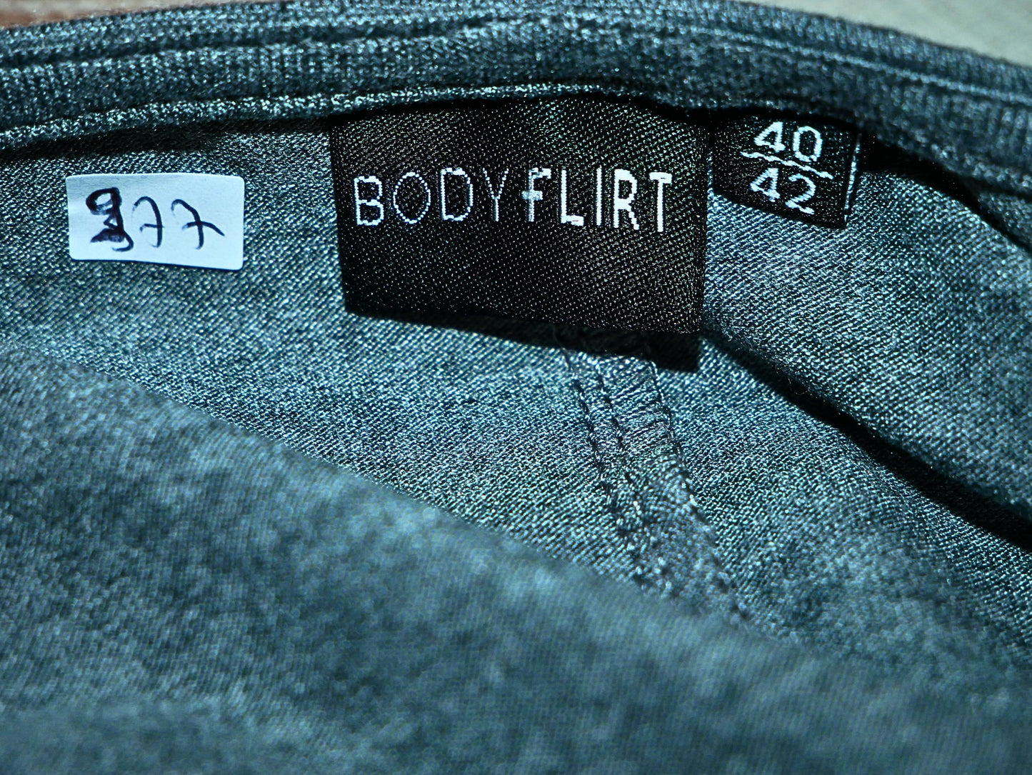Women's gray asymmetrical long sleeve top